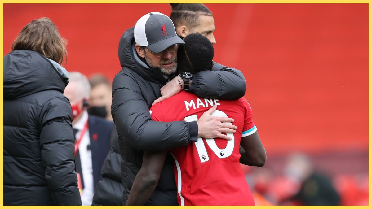 Jurgen Klopp, Manager of Liverpool embraces Sadio Mane following the Premier League match between Liverpool and Aston Villa at Anfield