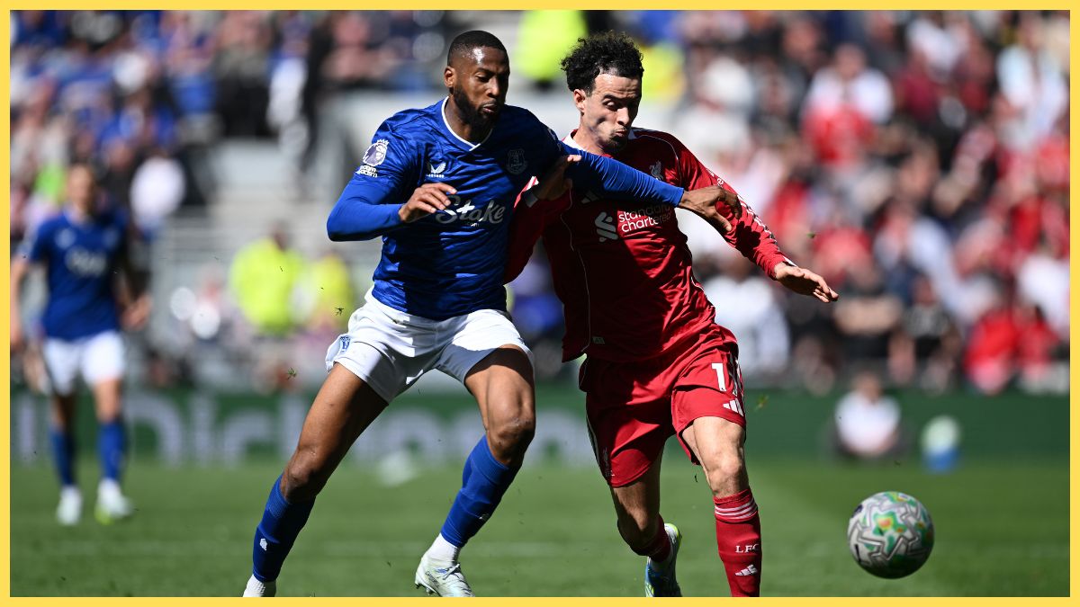 Curtis Jones of Liverpool is challenged by Beto of Everton during the Premier League match between Everton and Liverpool at Hill Dickinson Stadium