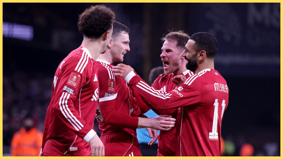 Andrew Robertson of Liverpool celebrates scoring his team's first goal with teammate Curtis Jones, Alexis Mac Allister and Mohamed Salah during the Emirates FA Cup Fifth Round match between Wolverhampton Wanderers and Liverpool