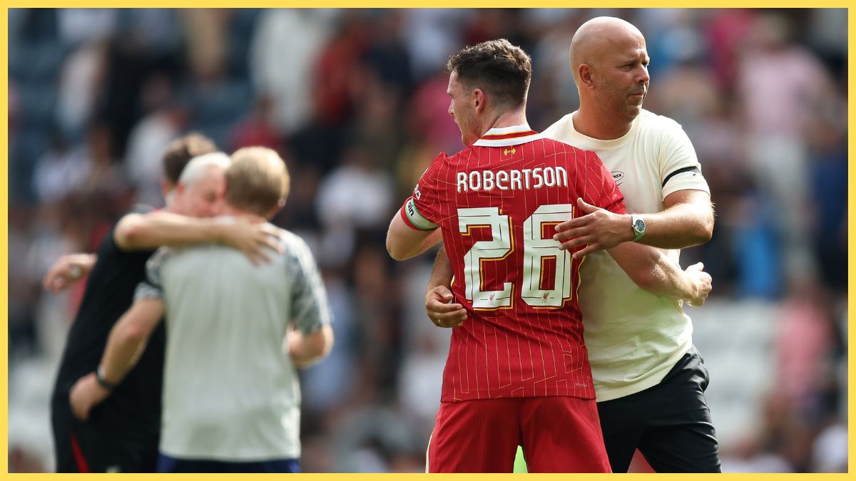 Arne Slot, Manager of Liverpool, hugs Andy Robertson after the pre-season friendly match between Preston North End and Liverpool at Deepdale