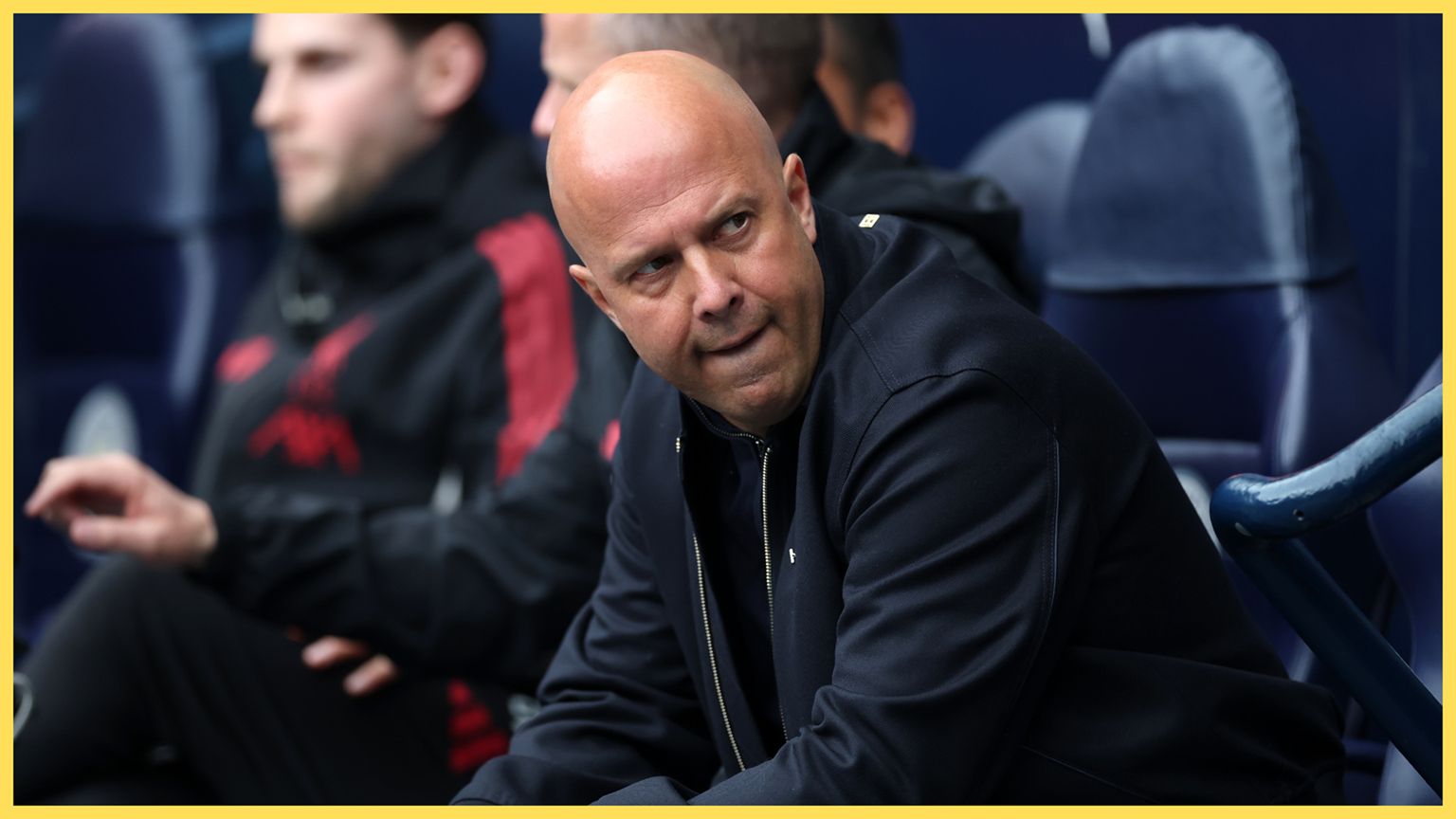 Arne Slot looks on from Liverpool bench.