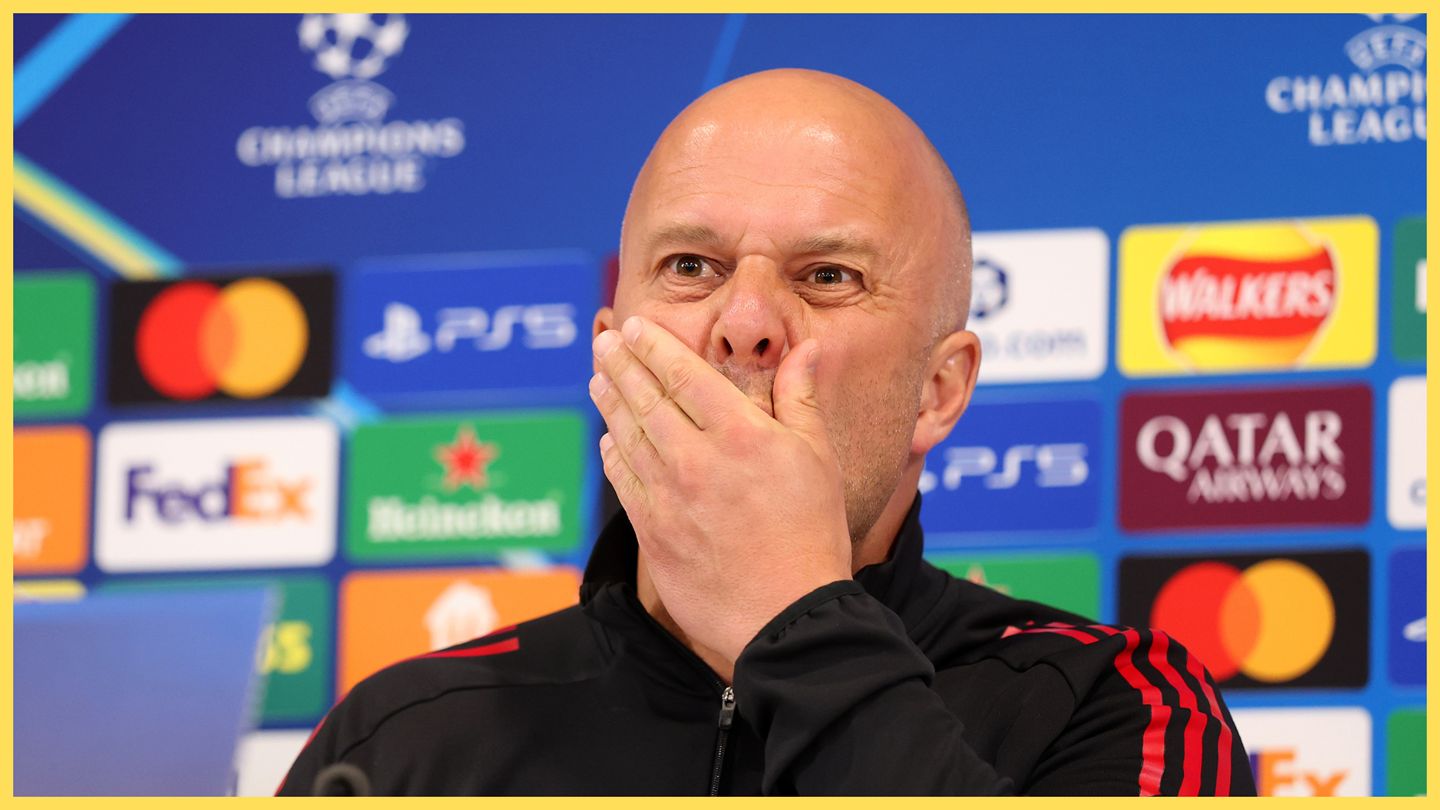 Arne Slot covers his mouth during Liverpool press conference.