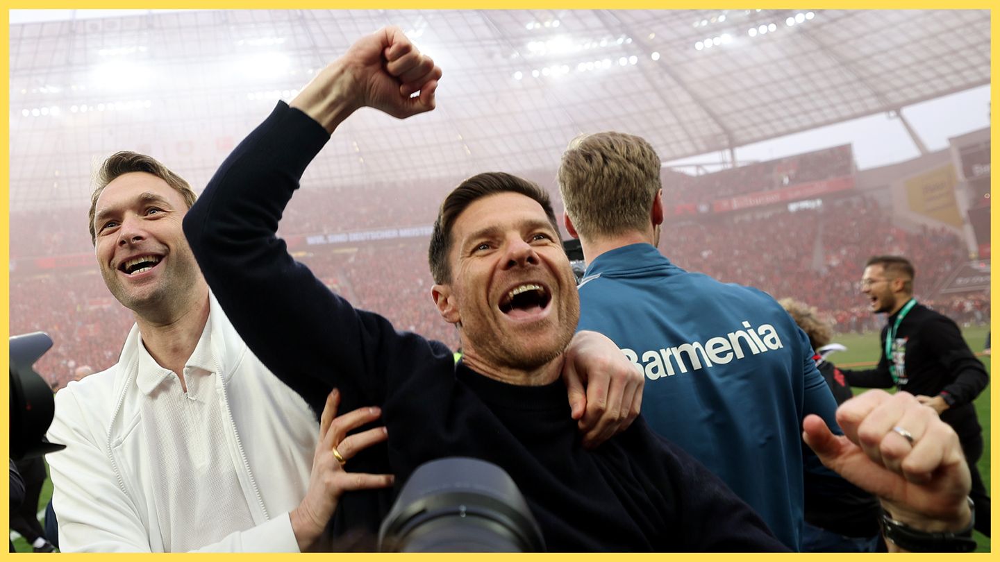 Xabi Alonso punches the air in celebration.