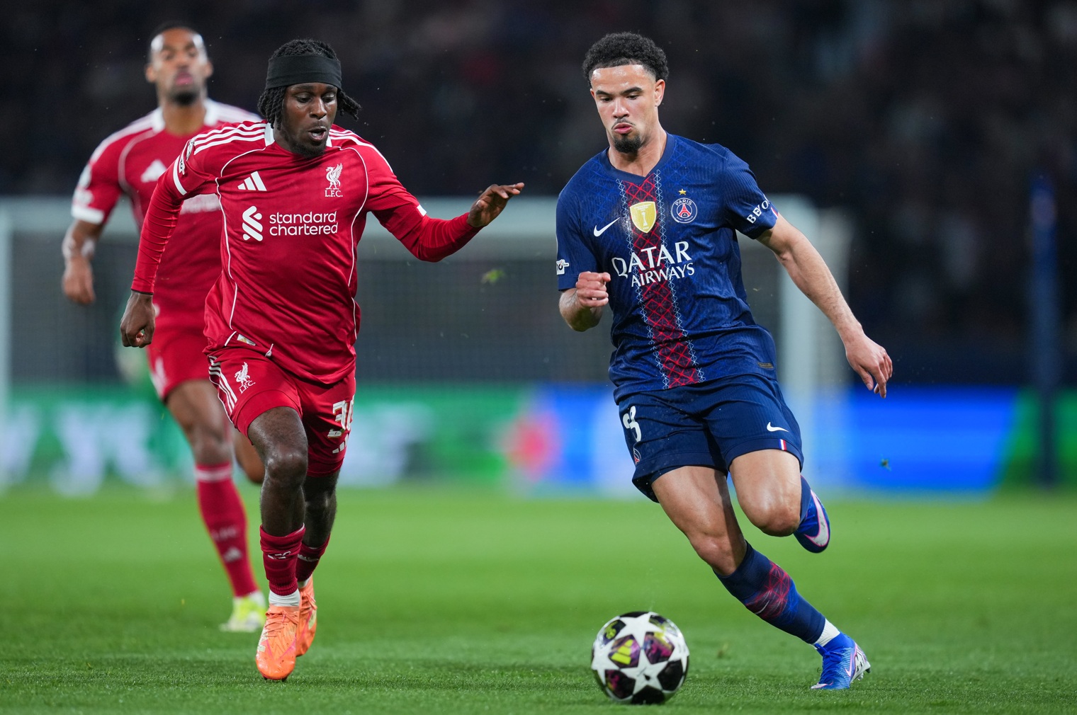 Jeremie Frimpong chases down Warren Zaire-Emery during Liverpool's Champions League tie against PSG