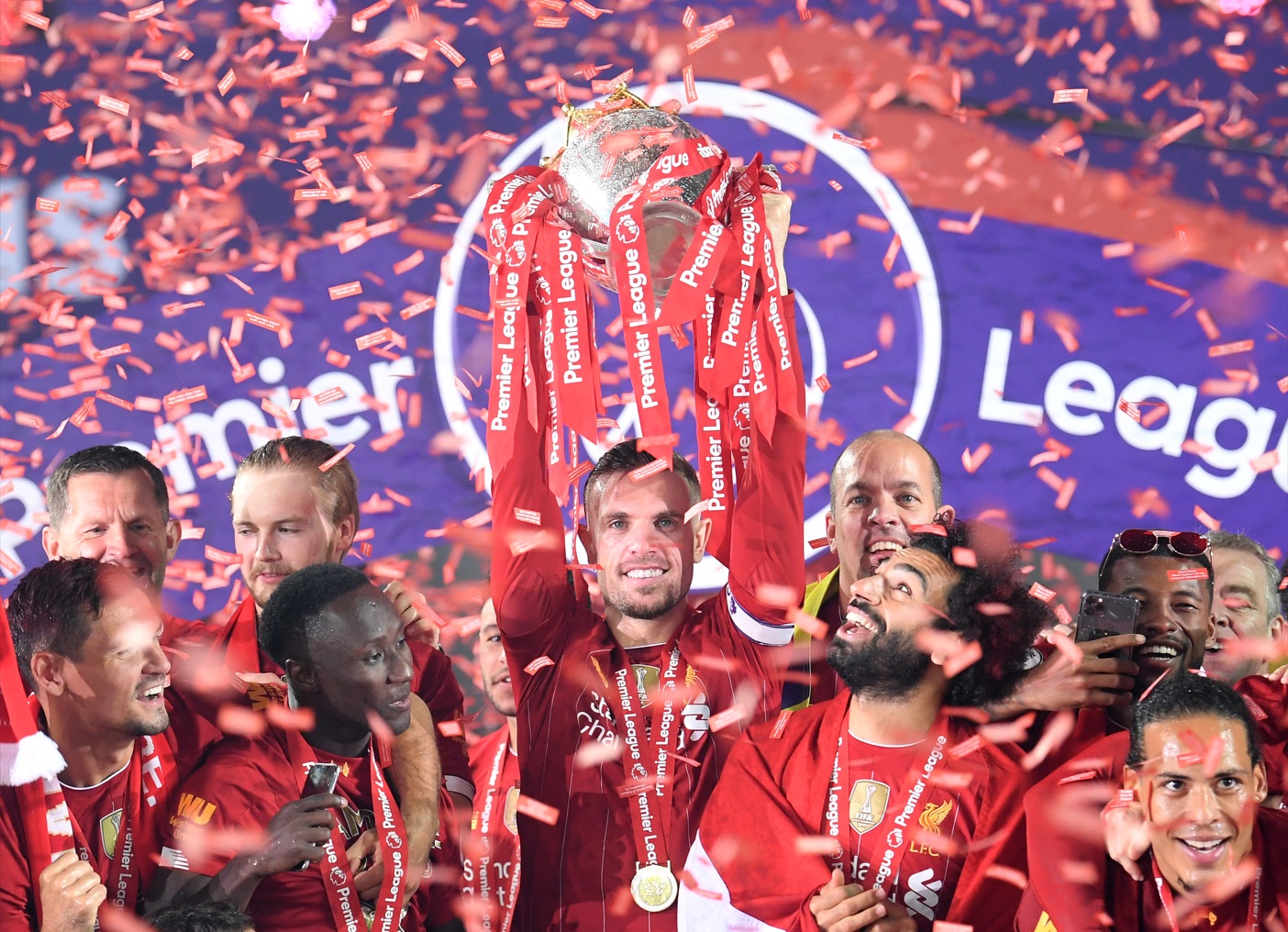 Jordan Henderson lifts the Premier League trophy as Liverpool captain in 2020