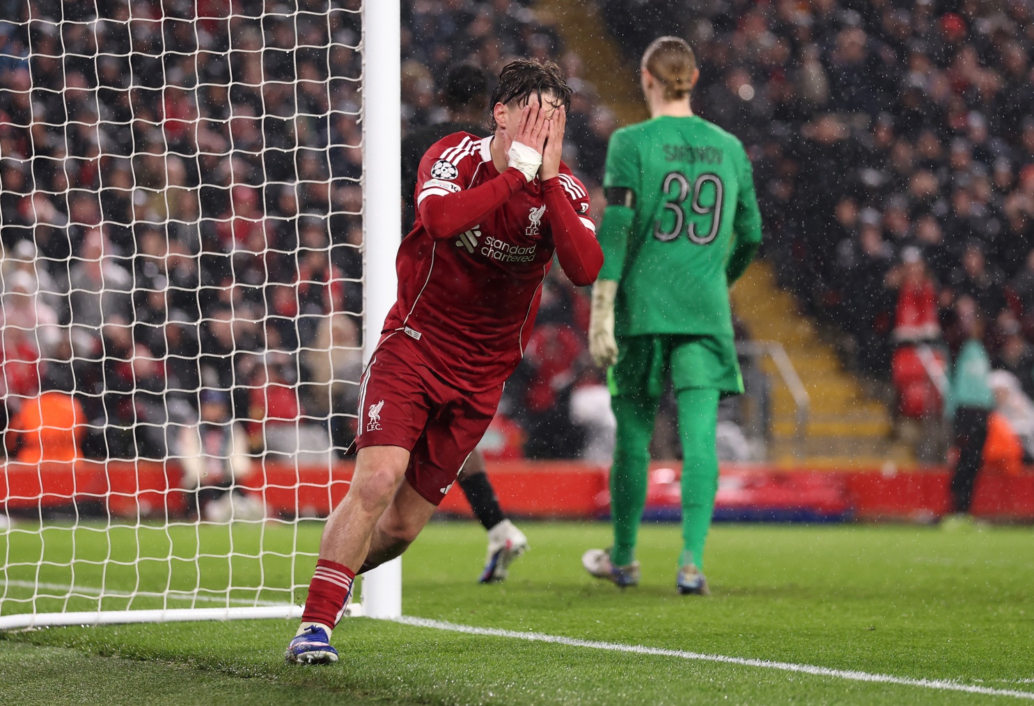 Milos Kerkez reacts to a missed chance for Liverpool against PSG at Anfield