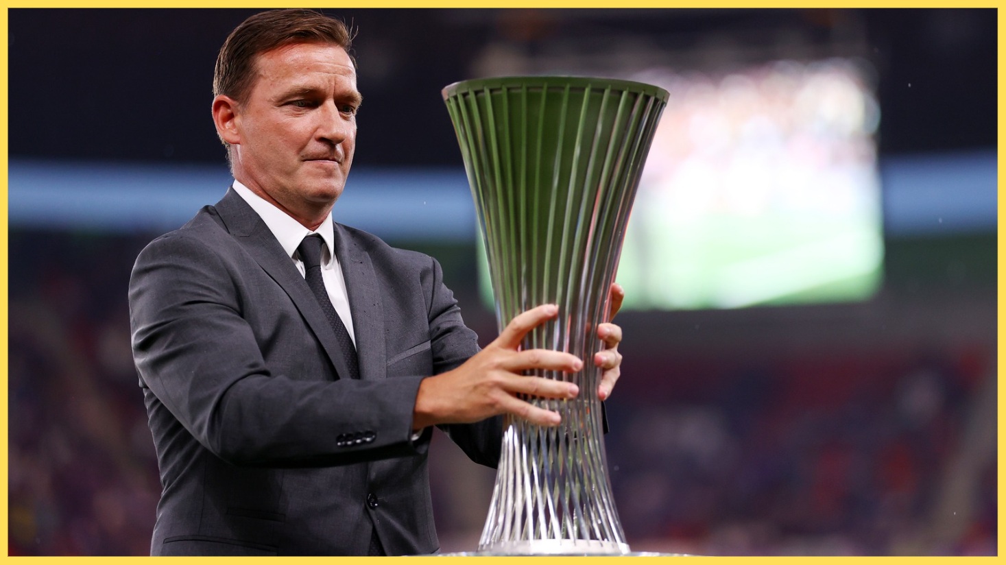 Vladimir Smicer holds the Conference League trophy in 2023