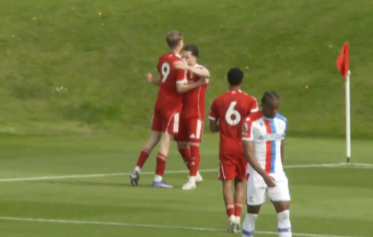 Will Wright celebrates with Kieran Morrison after scoring for Liverpool under-21s against Crystal Palace