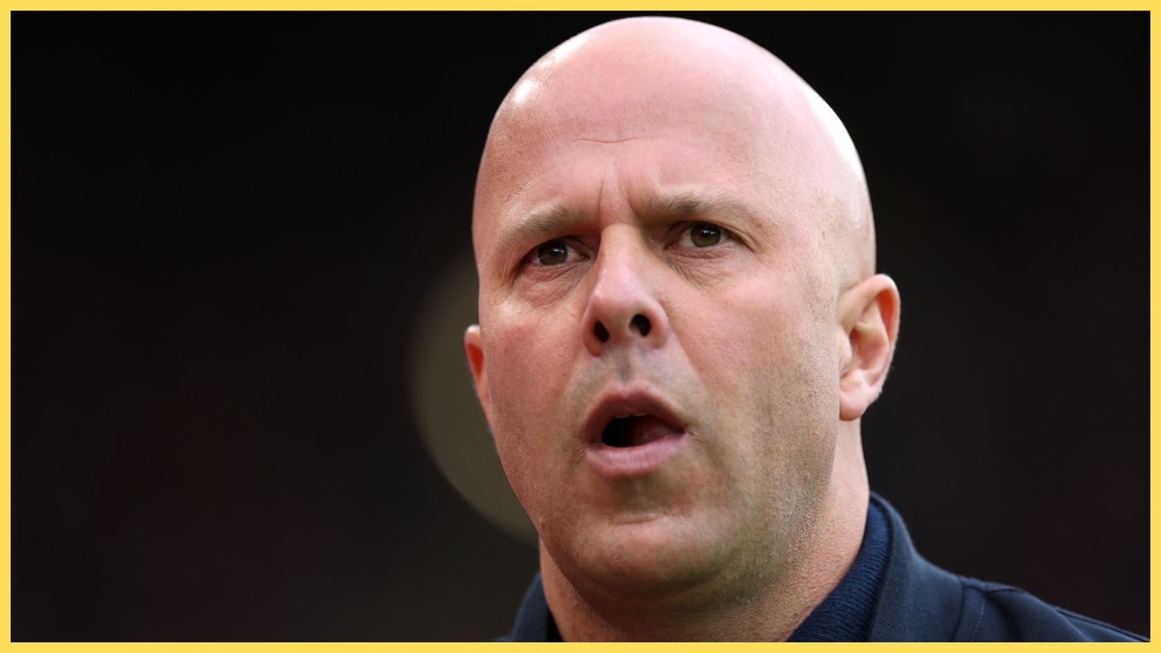Liverpool manager Arne Slot looks on in open-mouthed surprise.