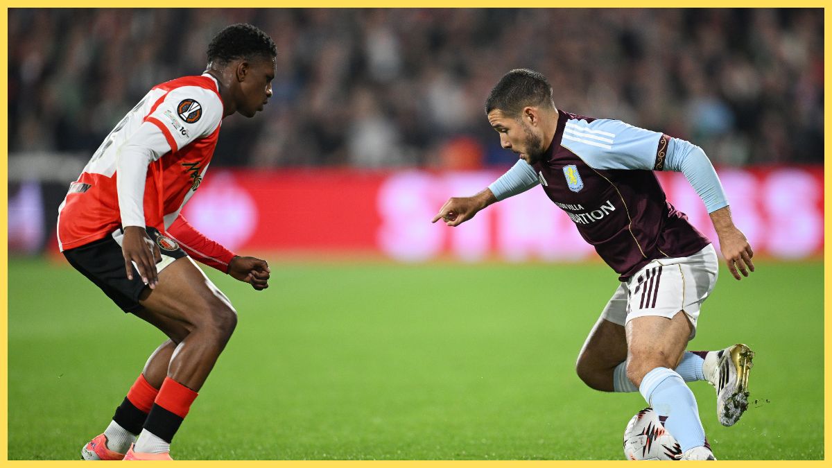 Emiliano Buendia of Aston Villa controls the ball whilst under pressure from Givairo Read of Feyenoord during the UEFA Europa League 2025/26 League Phase MD2 match between Feyenoord and Aston Villa FC at De Kuip