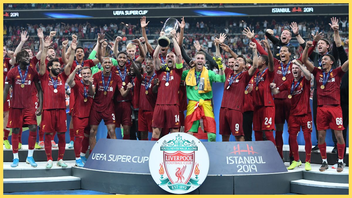 Jordan Henderson of Liverpool lifts the UEFA Super Cup trophy as Liverpool celebrate victory following the UEFA Super Cup match between Liverpool and Chelsea at Vodafone Park