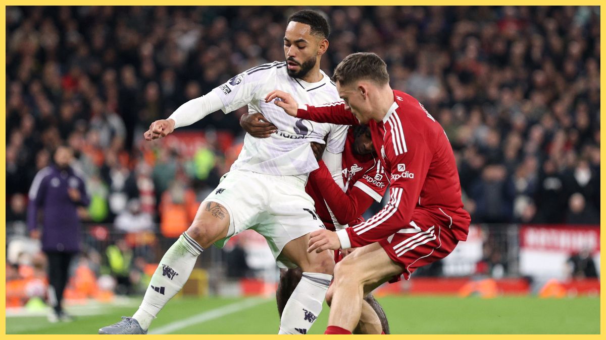 Matheus Cunha of Manchester United is challenged by Florian Wirtz of Liverpool during the Premier League match between Liverpool and Manchester United at Anfield