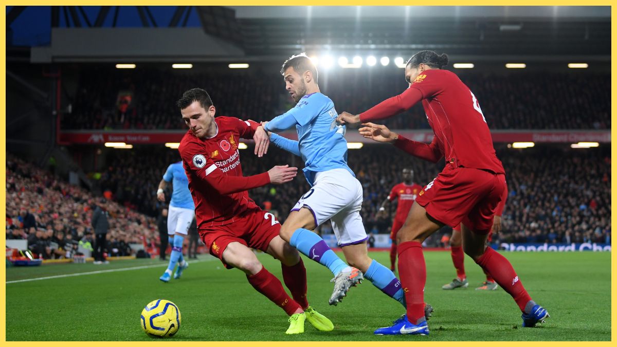 Bernardo Silva of Manchester City battles for possession with Virgil van Dijk and Andy Robertson of Liverpool during the Premier League match between Liverpool FC and Manchester City at Anfield