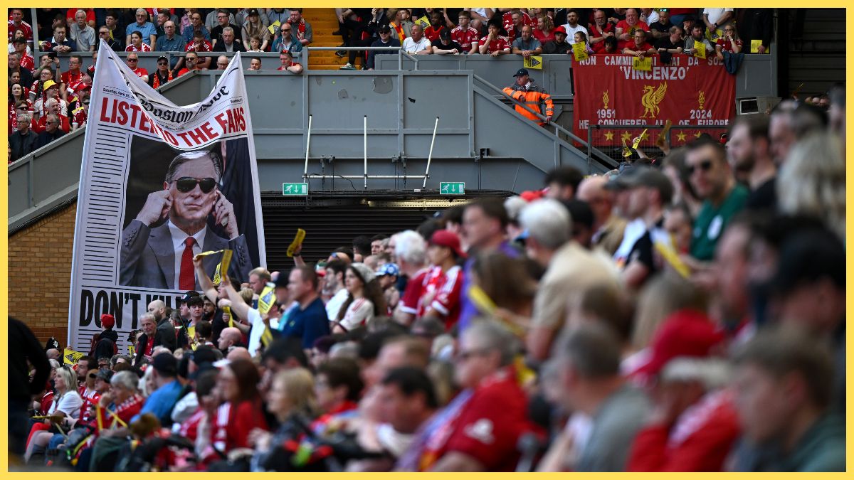 Liverpool fans protest rising ticket prices with posters that read 'Caution, Anfield's soul at risk' and a banner of owner, John Henry during the Premier League match between Liverpool and Crystal Palace at Anfield