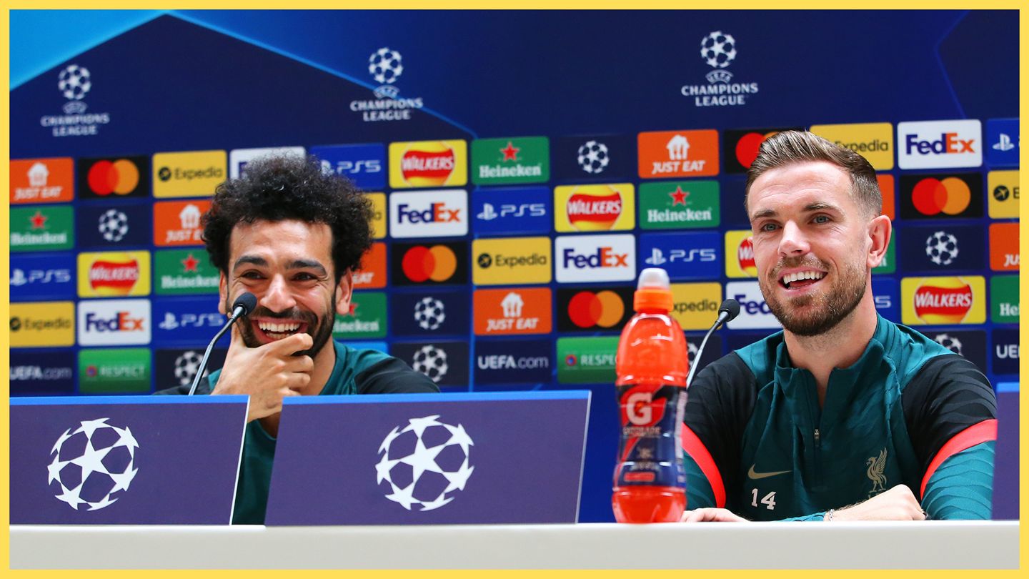 Jordan Henderson and Mo Salah laugh during Liverpool press conference.