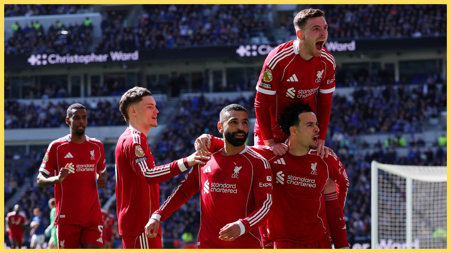Mo Salah celebrates with Liverpool teammates.