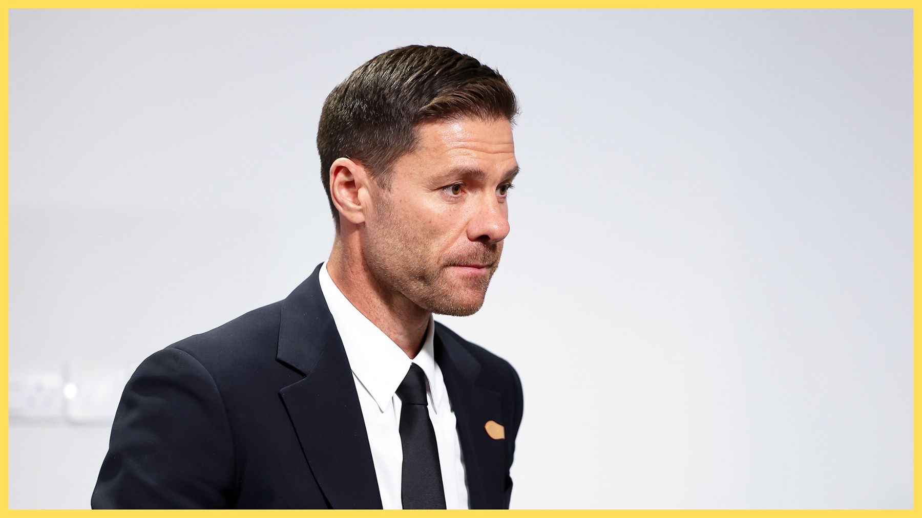 Xabi Alonso in a black suit and tie.
