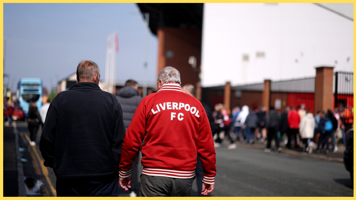 Liverpool fans make their way to Anfield for a Premier League match