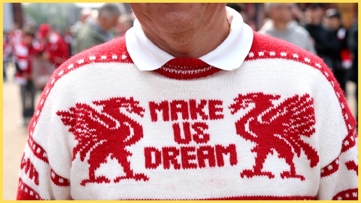 A Liverpool supporter sporting a 'Make Us Dream' jumper