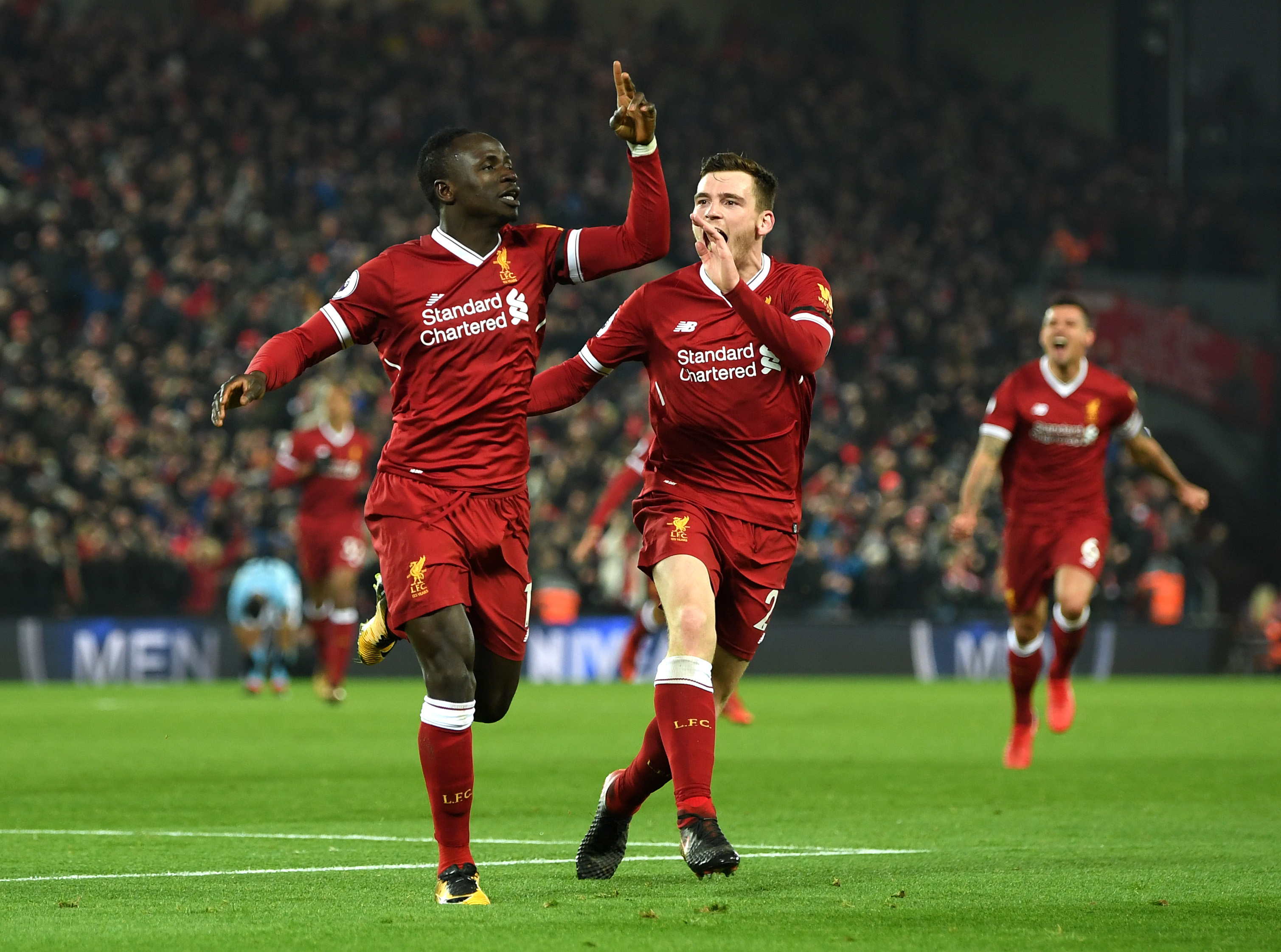 Sadio Mane and Andy Robertson celebrate during Liverpool's 4-3 win over Manchester City in 2018