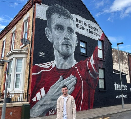 Andy Robertson pictured in front of his new mural on Tancred Road