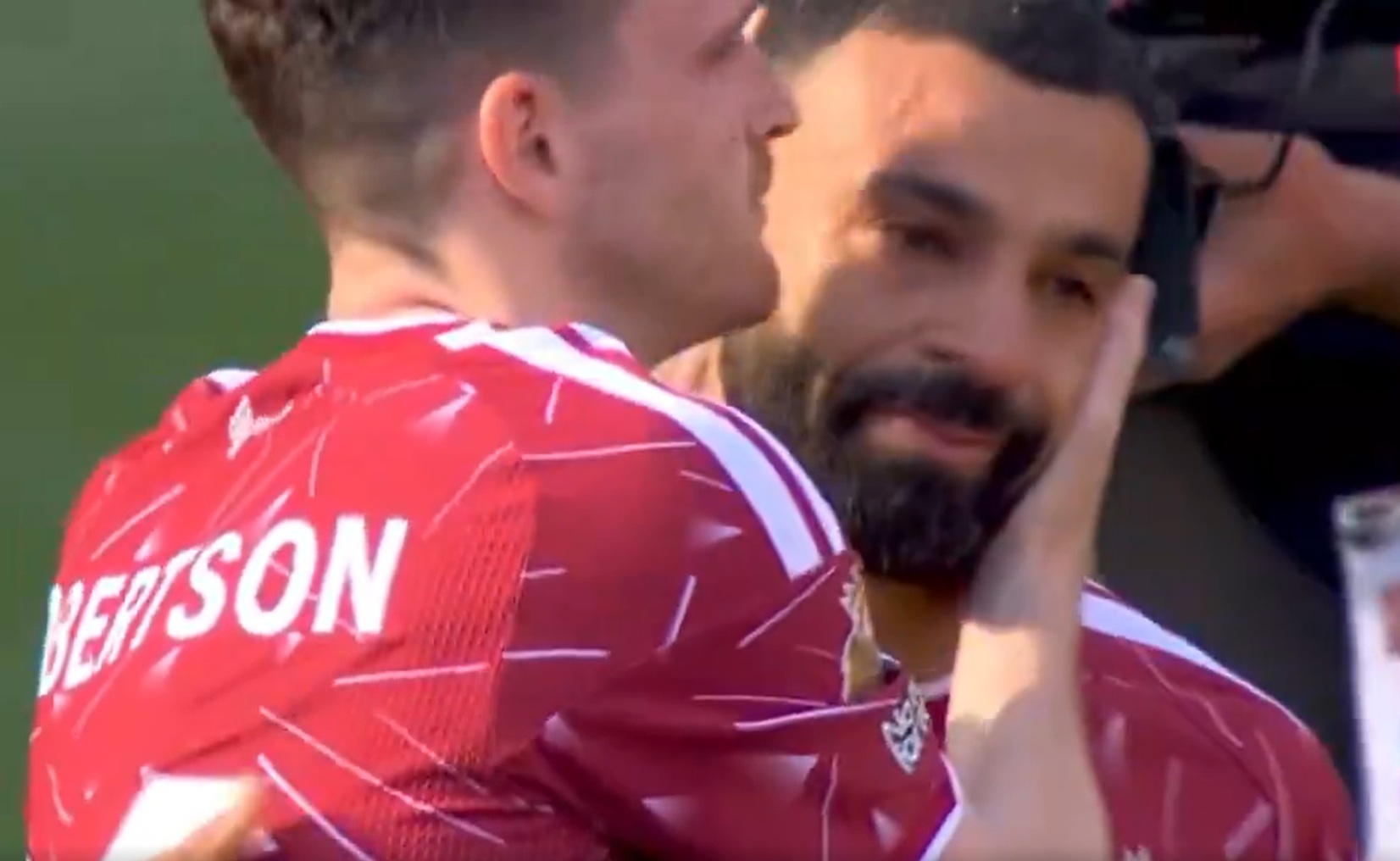 Andy Robertson and Mo Salah embrace after their final match for Liverpool