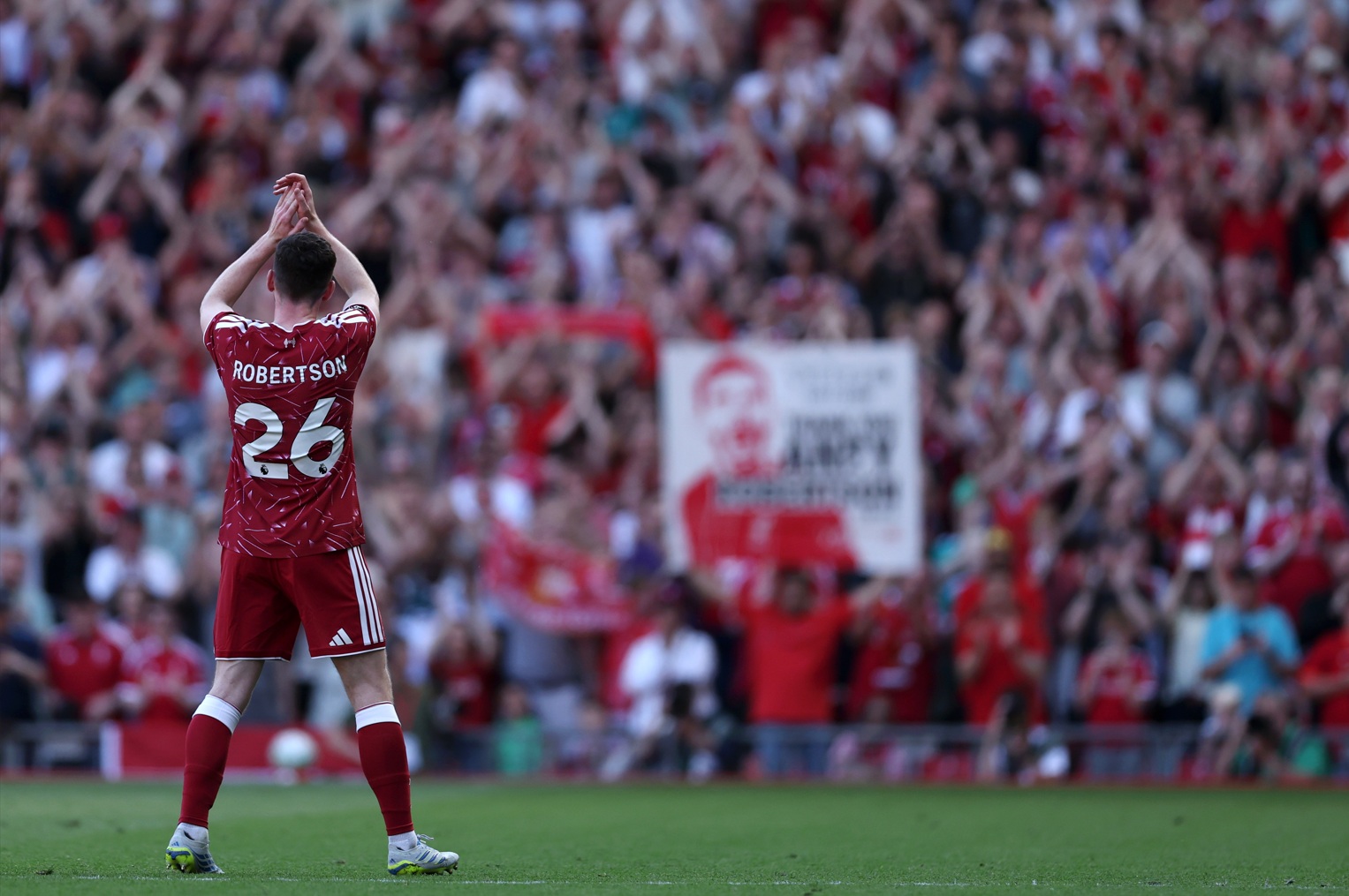 Andy Robertson applauds the Liverpool fans on his final appearance at Anfield