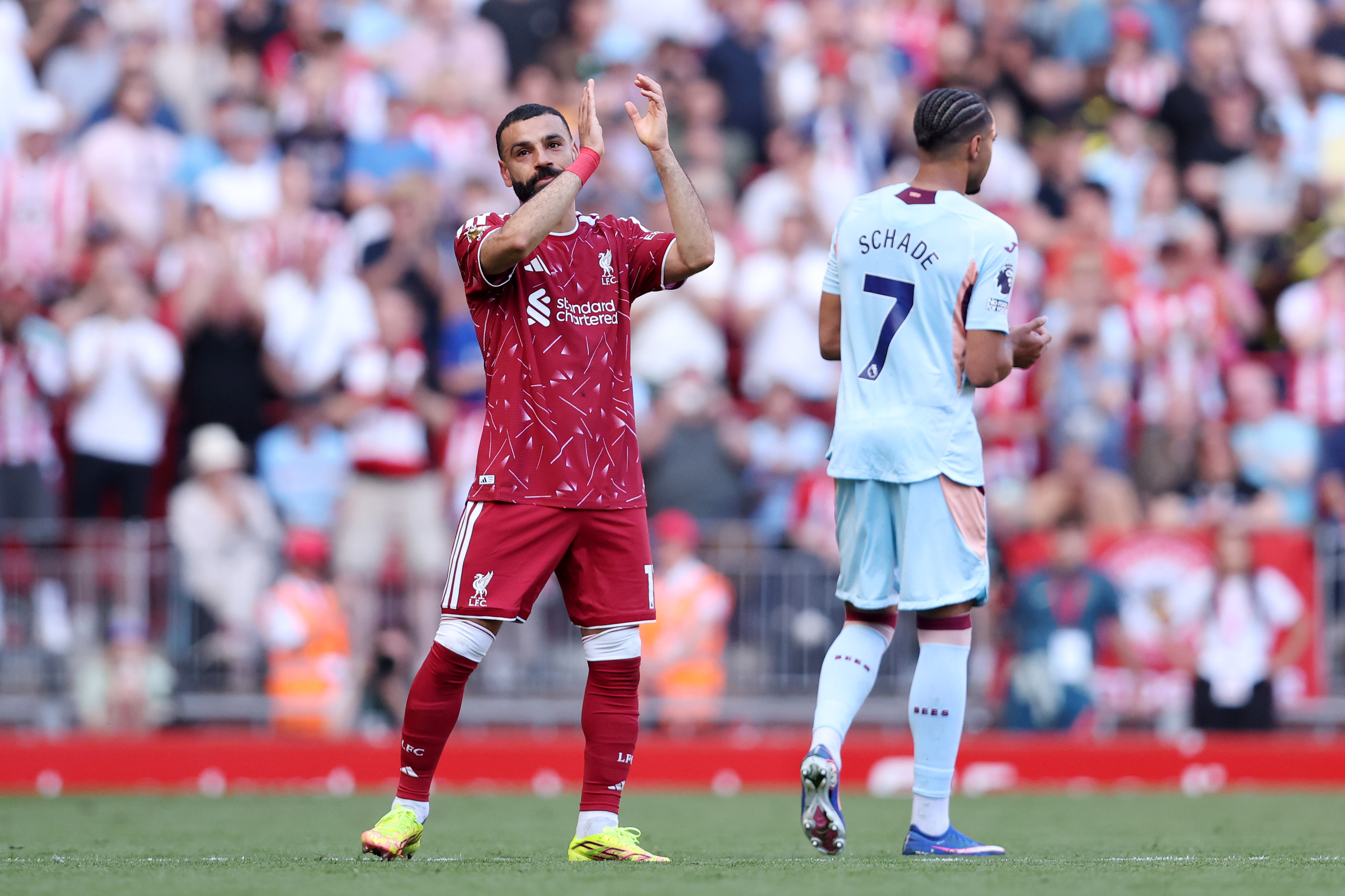 Mo Salah applauds the Liverpool fans as he's substituted at Anfield