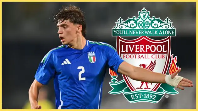 Marco Palestra looks to his right during Italy game next to Liverpool club crest.