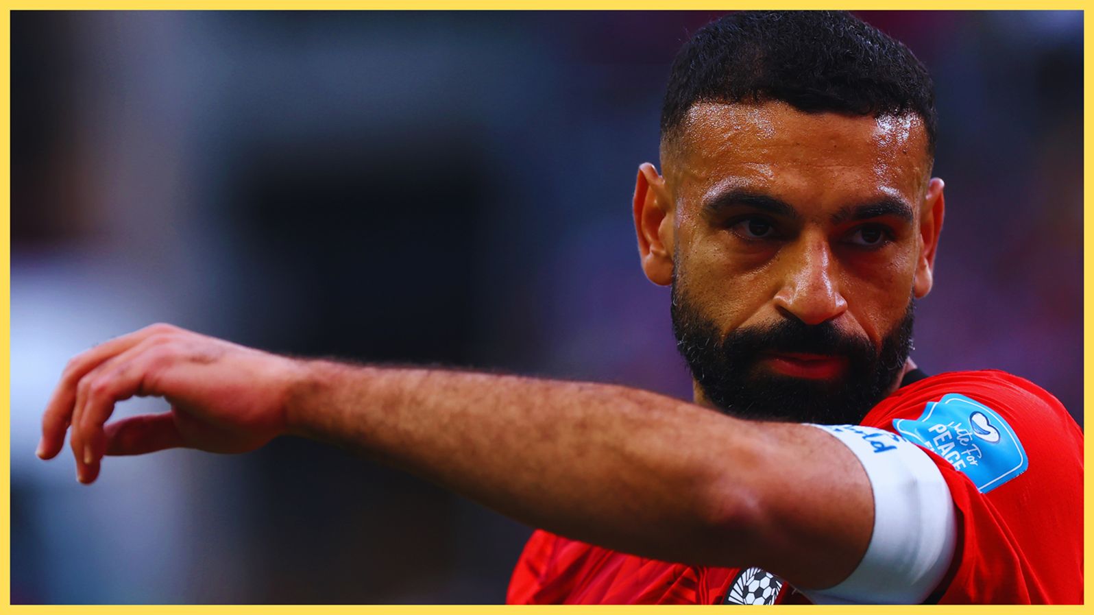 Liverpool forward Mo Salah raises his arm during Egypt game at the World Cup.