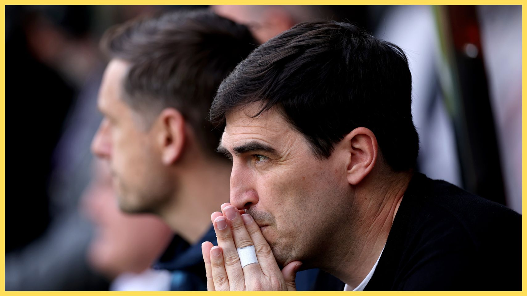Liverpool manager Andoni Iraola puts his folded hands to his mouth.