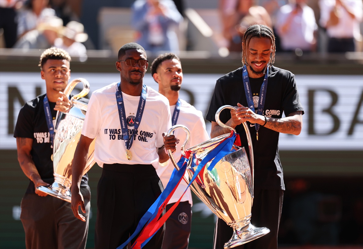 Bradley Barcola brandishes the Champions League trophy after PSG's success a fortnight ago
