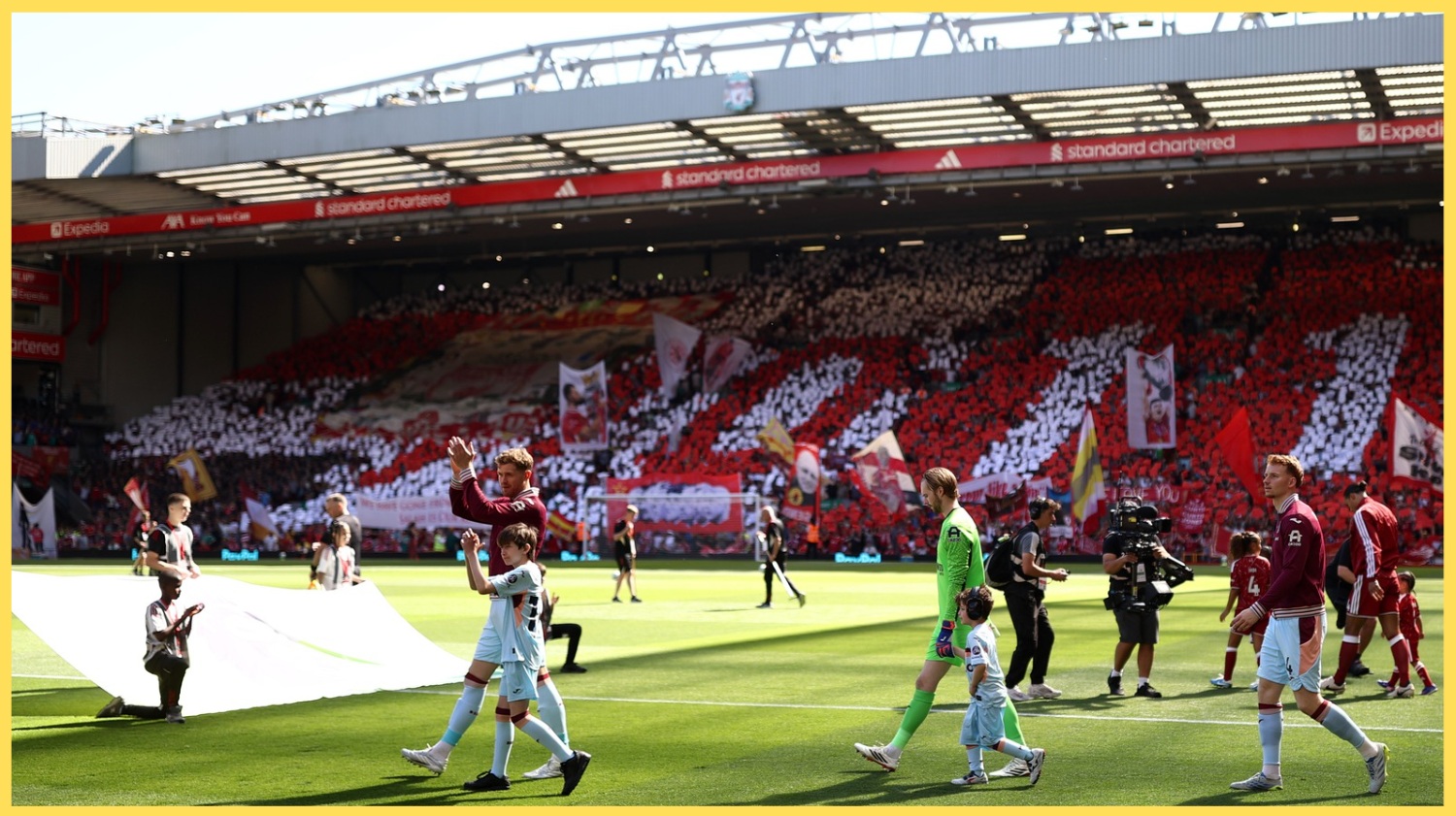 Liverpool players take to the pitch at Anfield