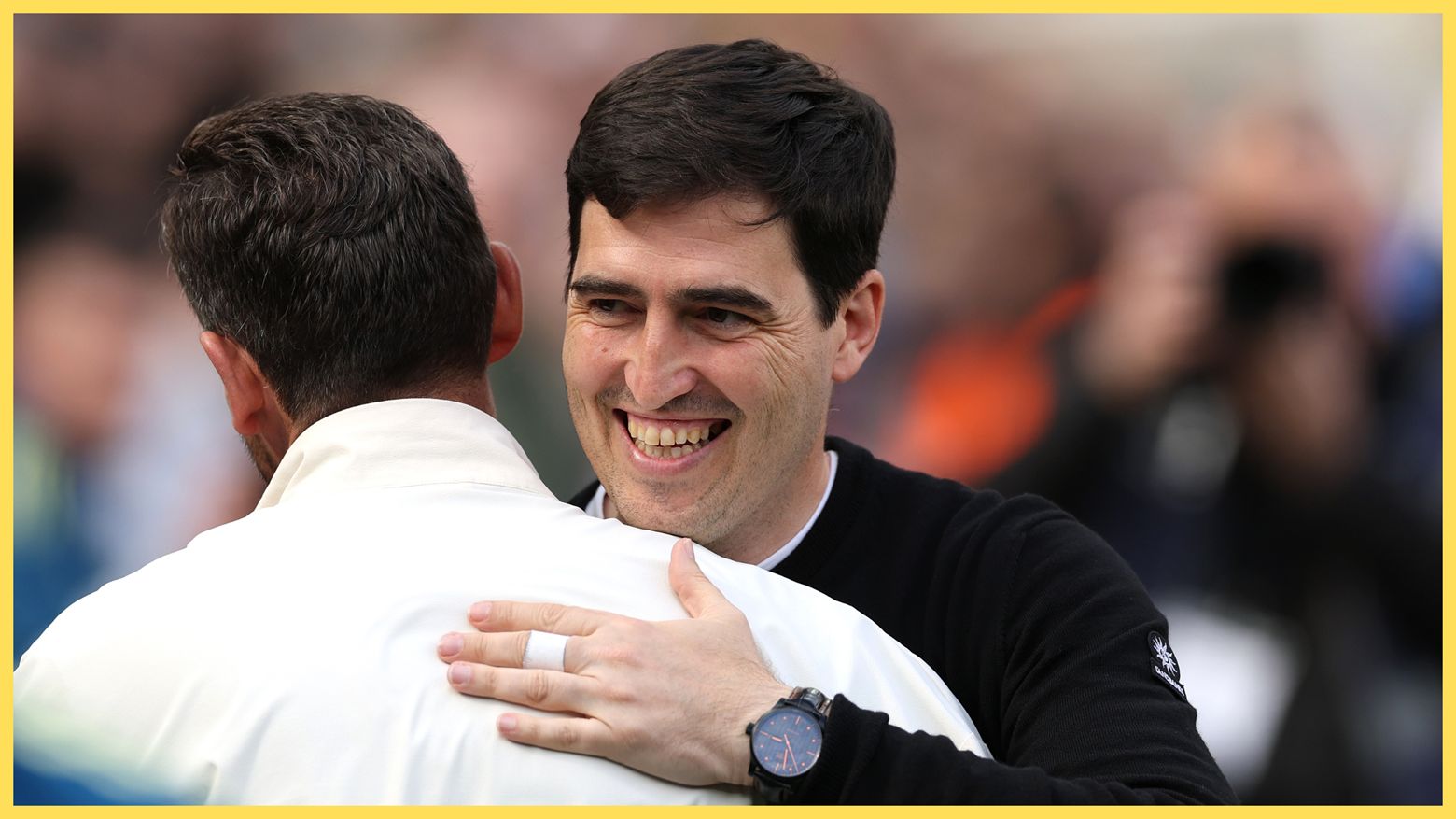 Liverpool manager Andoni Iraola hugs the Newcastle coach.