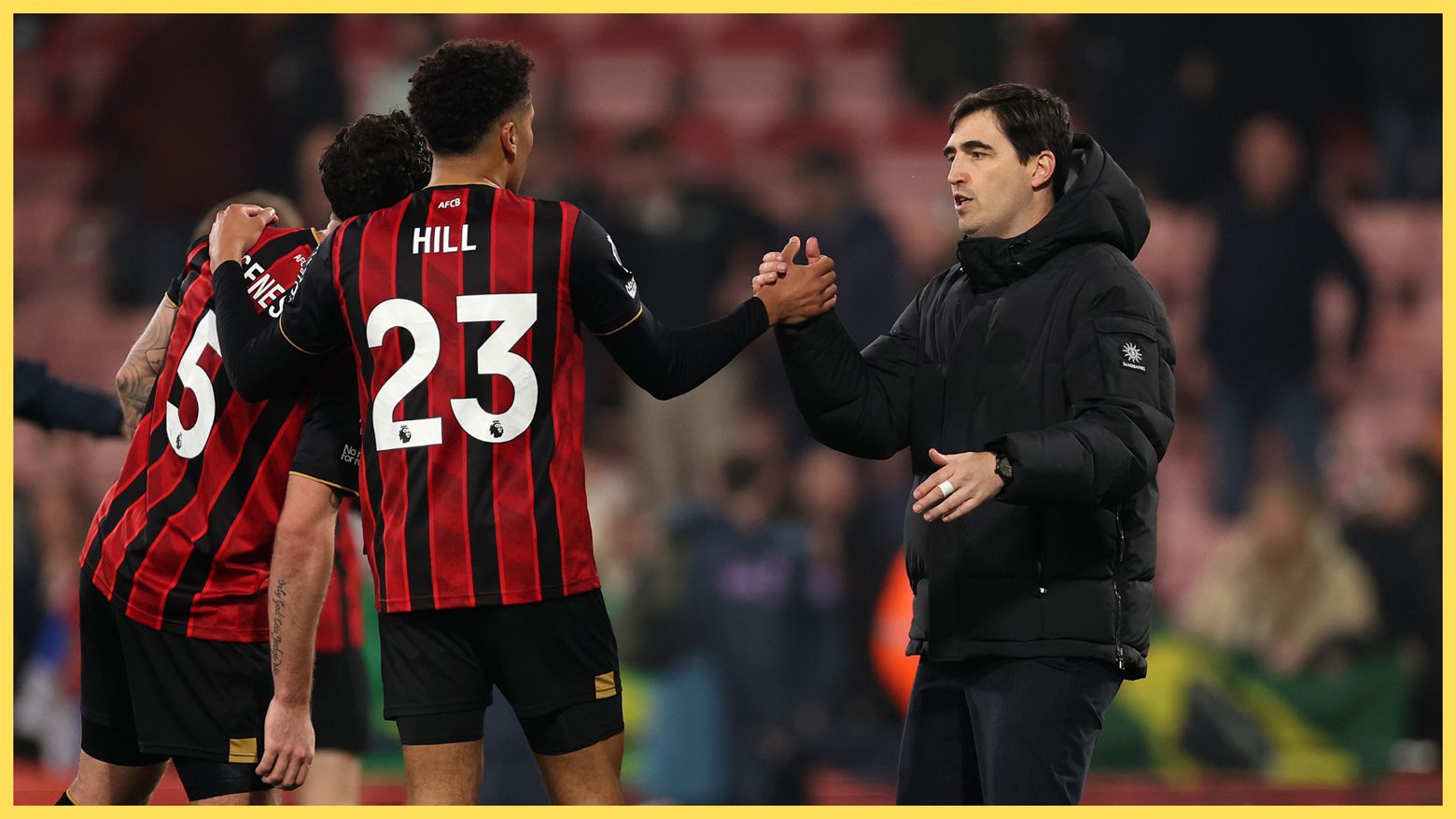 Liverpool manager Andoni Iraola claps hands with Bournemouth player.