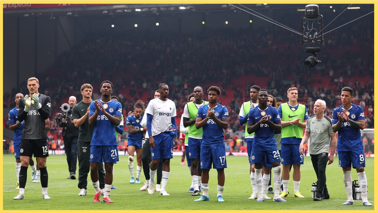 Chelsea players applaud their supporters after drawing at Anfield in May
