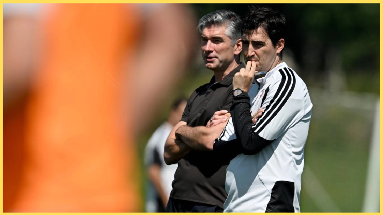 Richard Hughes and Andoni Iraola watch on during a Liverpool training session
