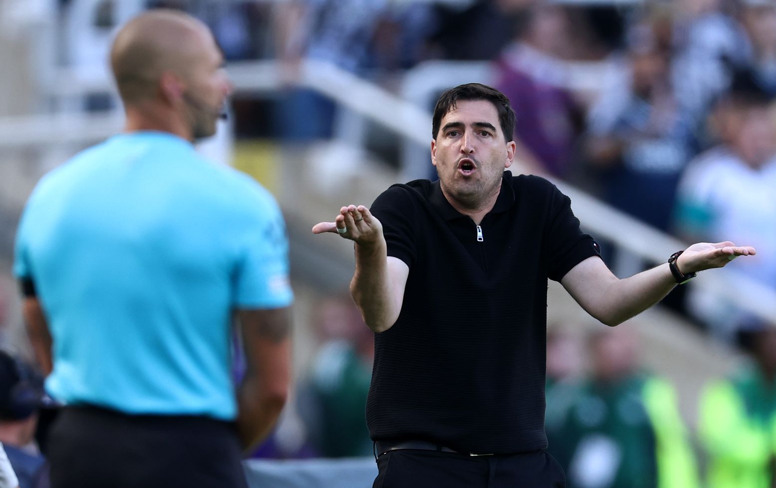 Andoni Iraola gestures in frustration to the fourth official during Liverpool vs Newcastle.
