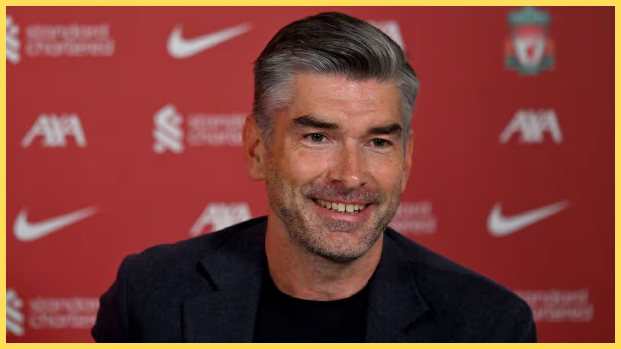 Liverpool sporting director Richard Hughes smiles during press conference.