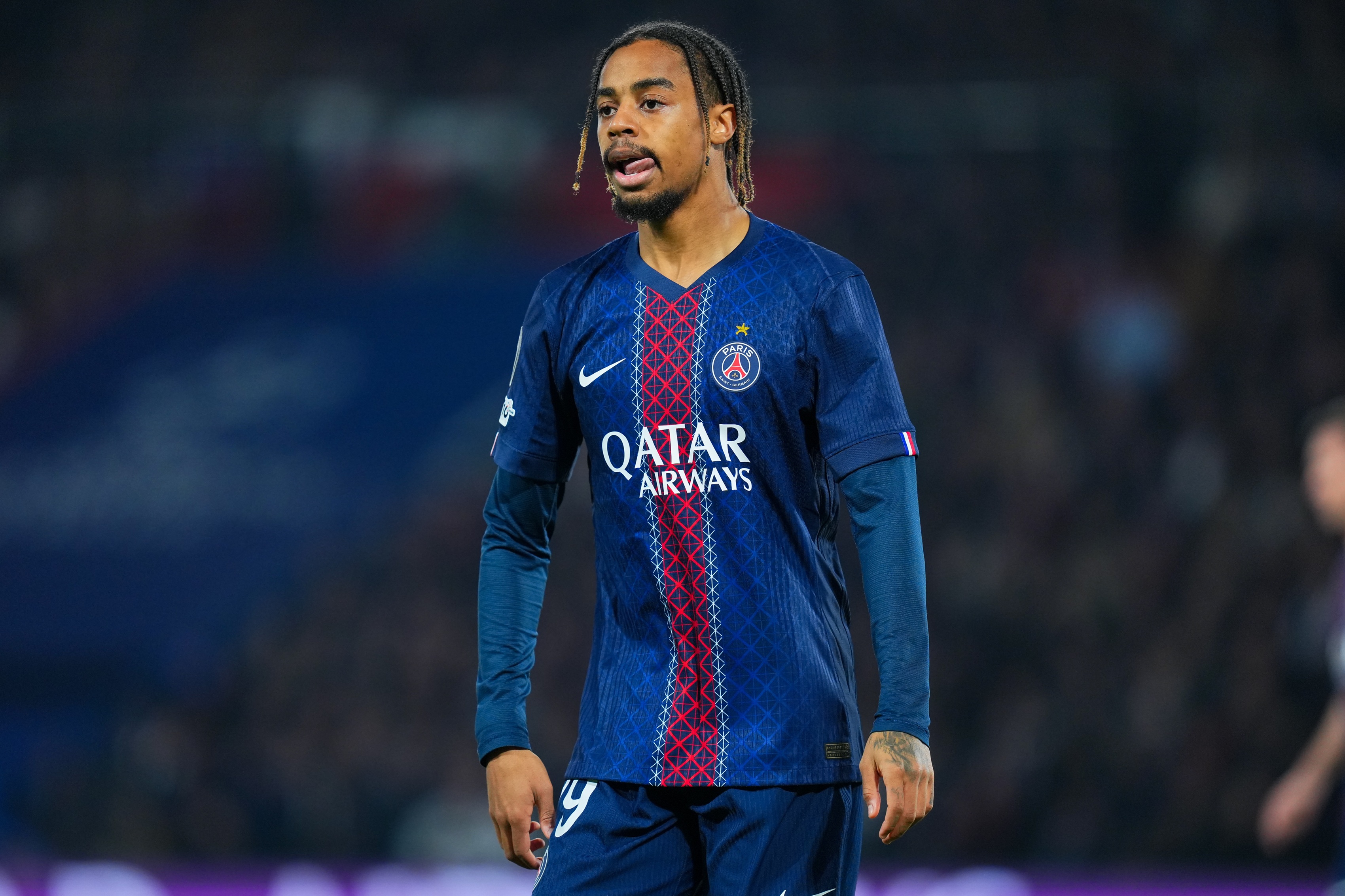 Liverpool transfer target Bradley Barcola licks his lips during PSG game.