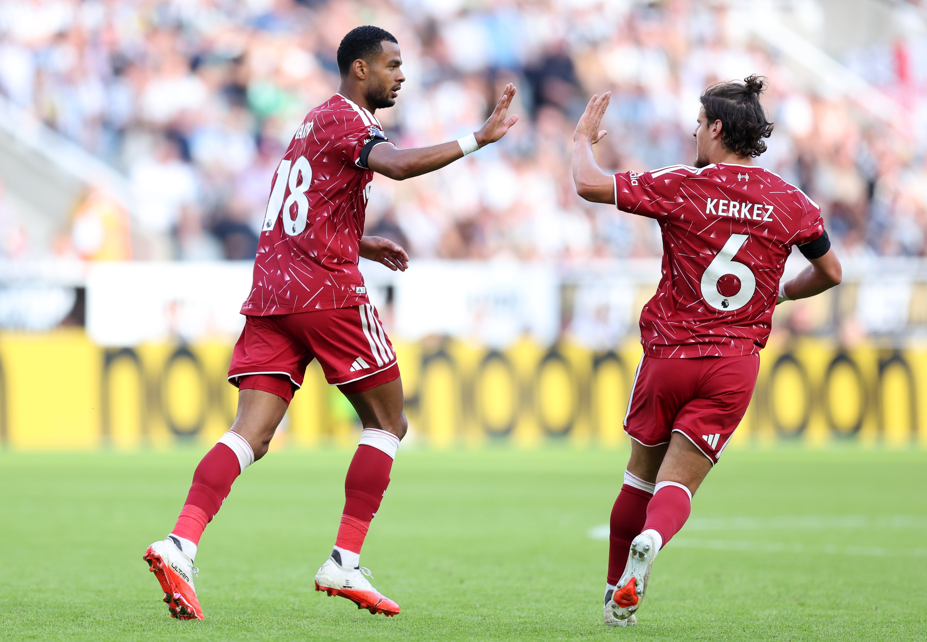 Liverpool winger Cody Gakpo high fives Milos Kerkez after scoring vs Newcastle.