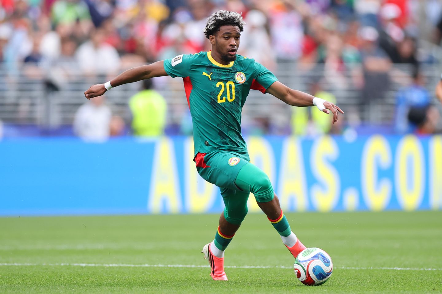 Liverpool transfer target Ibrahim Mbaye dribbles with the ball at the World Cup.