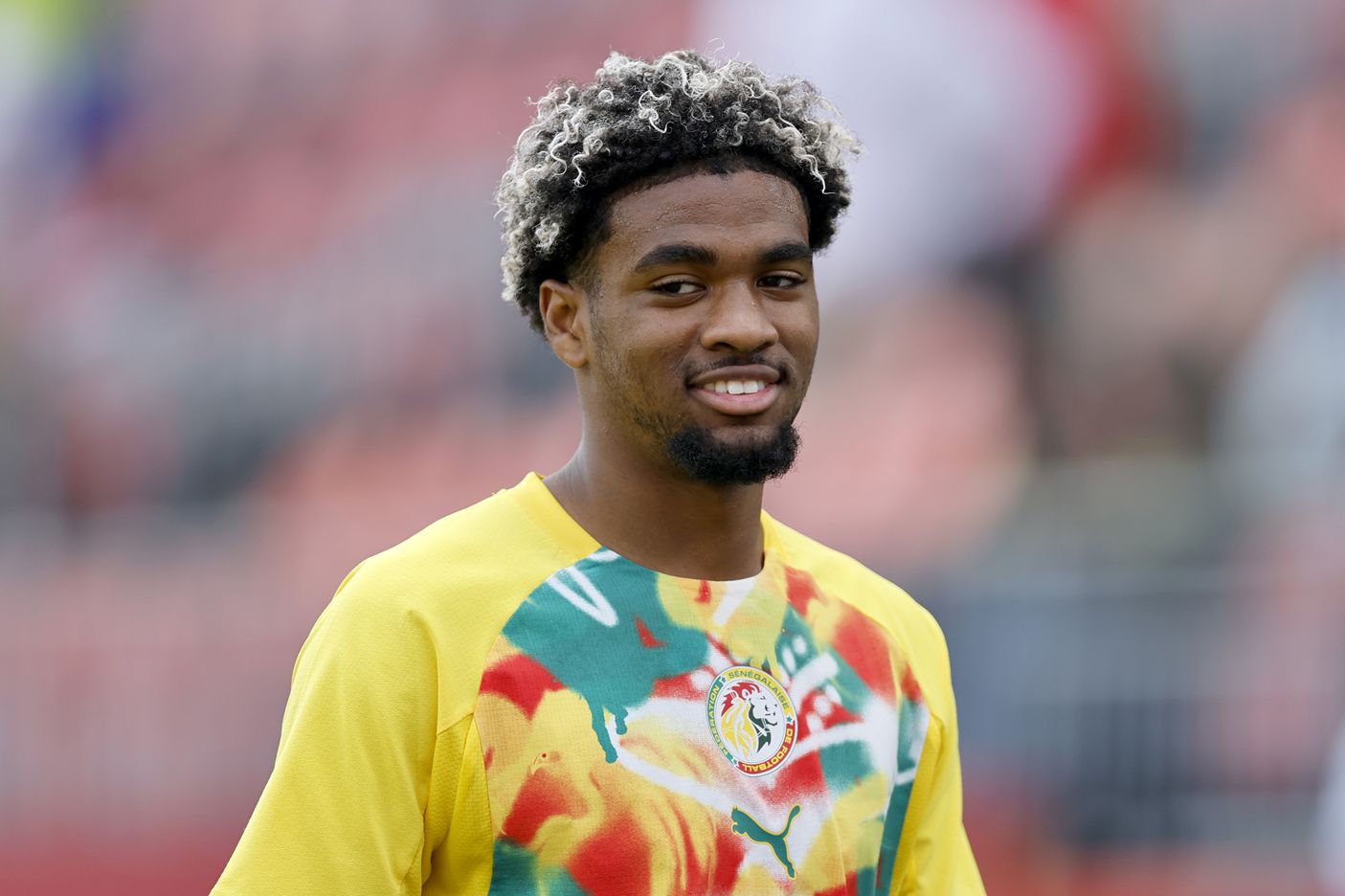 Liverpool transfer target Ibrahim Mbaye smiles ahead of Senegal game.