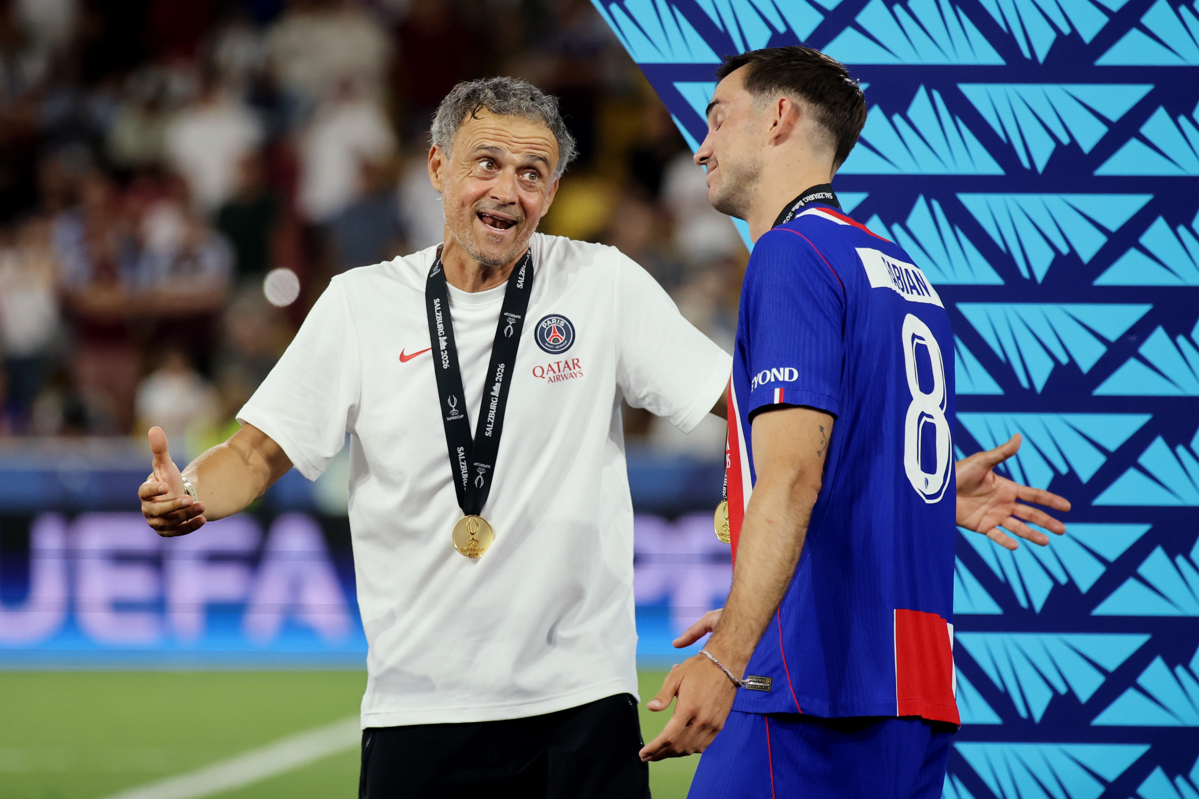 PSG head coach Luis Enrique speaks with Fabian Ruiz.