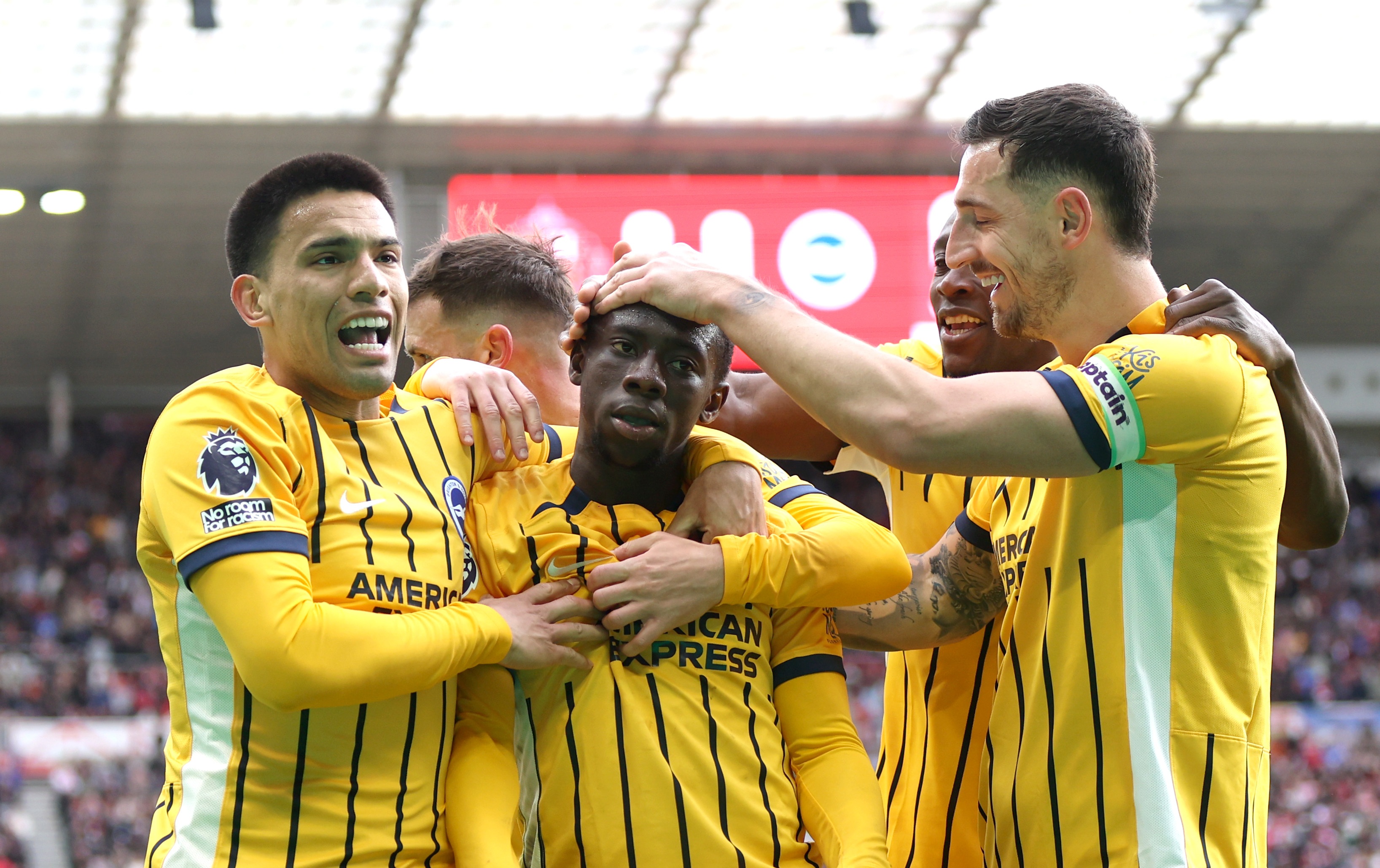 Liverpool transfer target Yankuba Minteh celebrates with Brighton teammates after scoring against Sunderland.