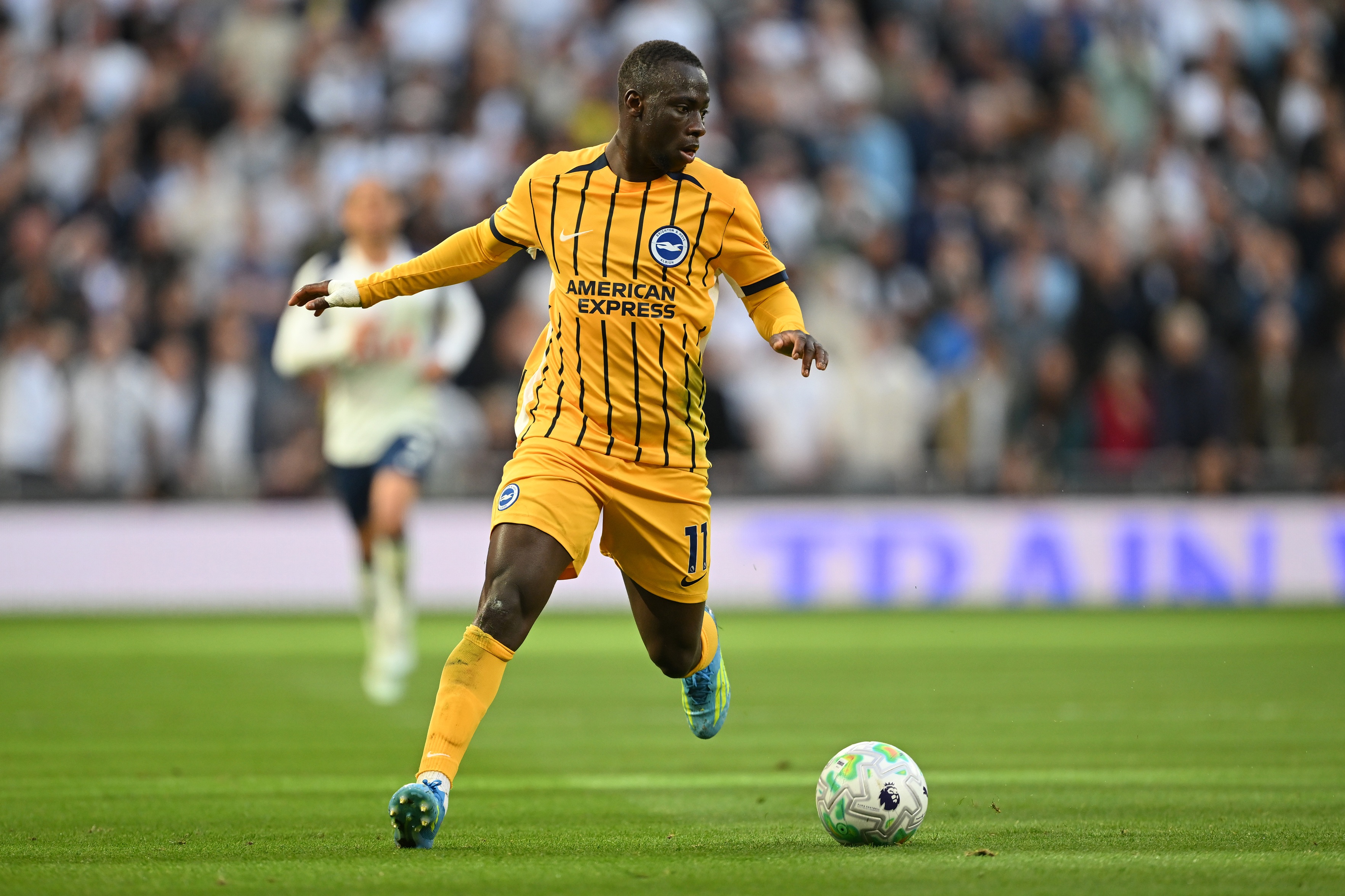 Liverpool transfer target Yankuba Minteh dribbles on the ball for Brighton.