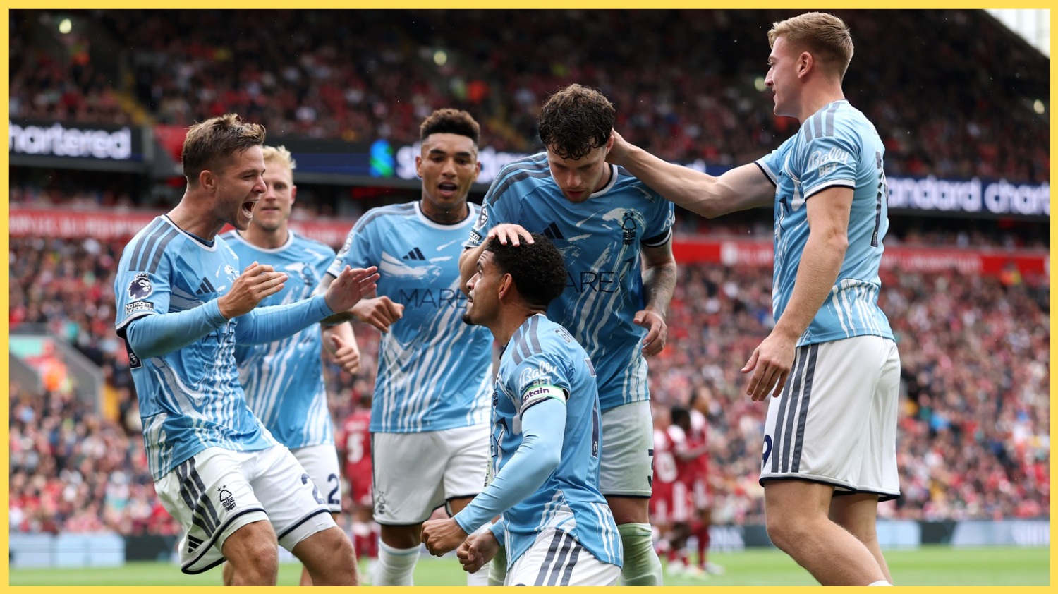 Morgan Gibbs-White celebrates with his teammates after scoring at Anfield