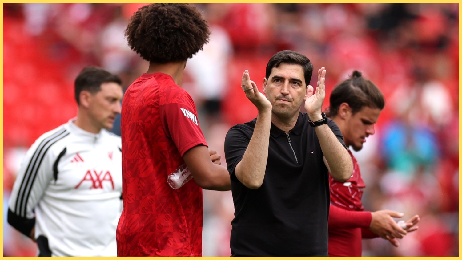 Andoni Iraola applauds the fans after a game at Anfield