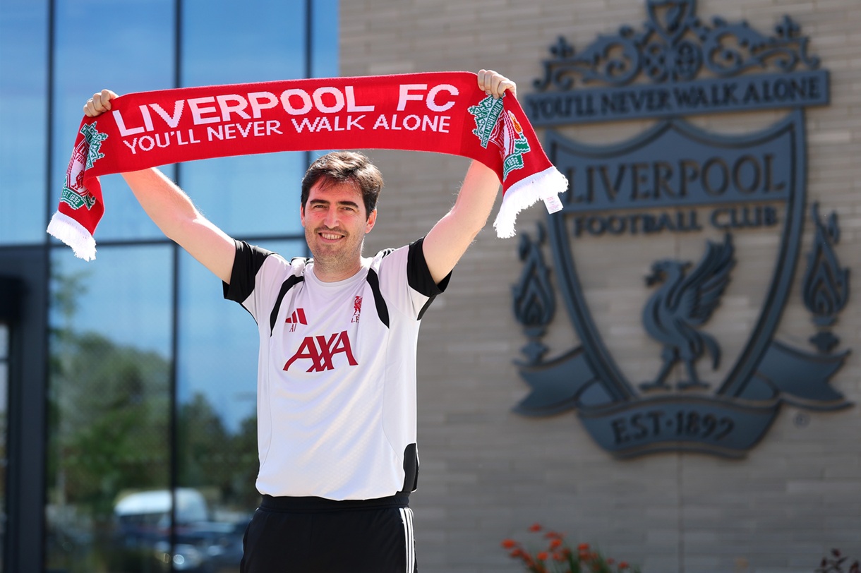 Andoni Iraola holds up a Liverpool scarf outside the AXA Training Centre