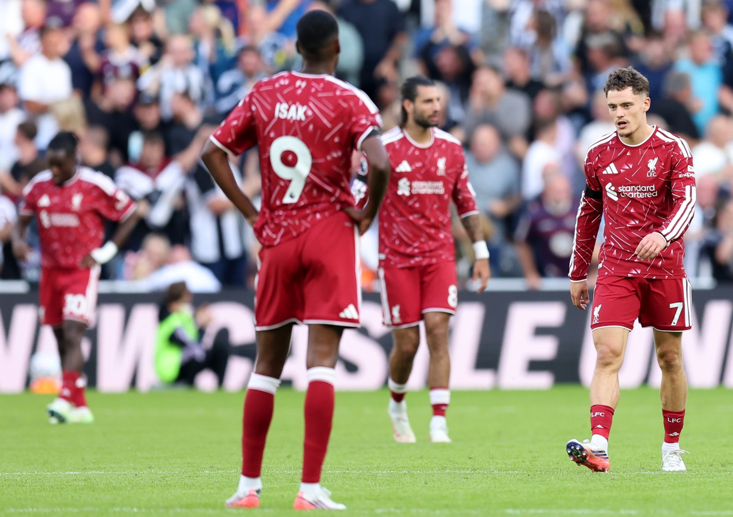 Liverpool players look despondent after conceding a goal against Newcastle